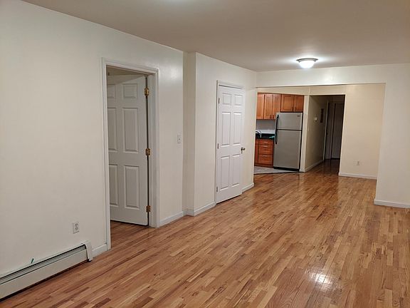 exta long living room, dining area and coat closet