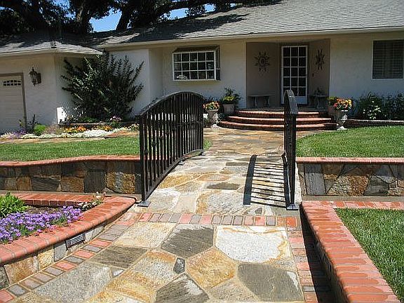 Custom bridge over a (mostly) dry creek... with Bouquet rock and brick feature