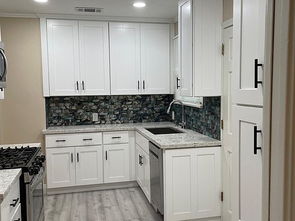 New kitchen includes gas stove/oven, microwave, and dish washer