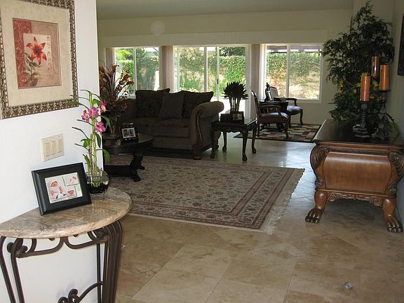 view of entry, travertine flooring throughout