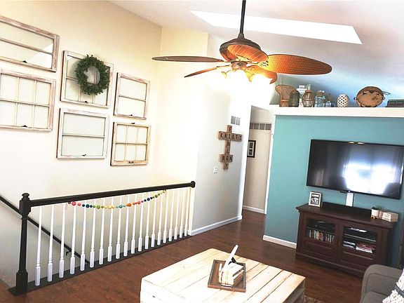 Spindle staircase to the finished walkout lower level.