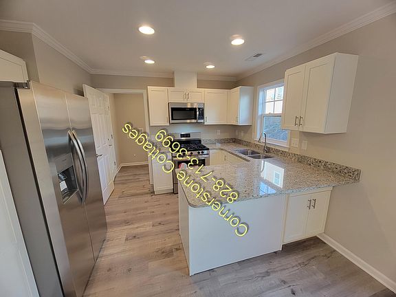 Gas range/oven, dishwasher, refrigerator with ice maker, washer dryer hookups off kitchen main level