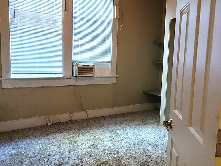 The third bedroom that is smaller