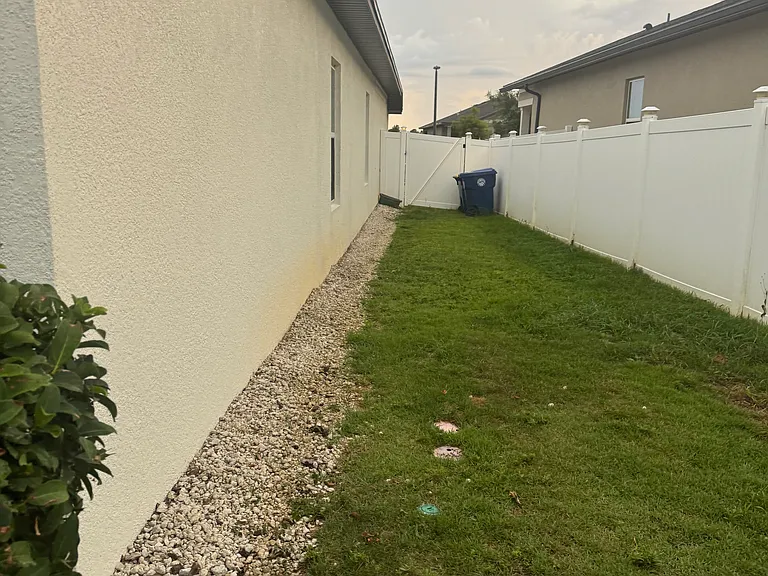 Side Patio 1 of 3 gates for easy access to trash cans