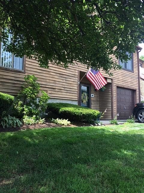 outside entryway and attached garage