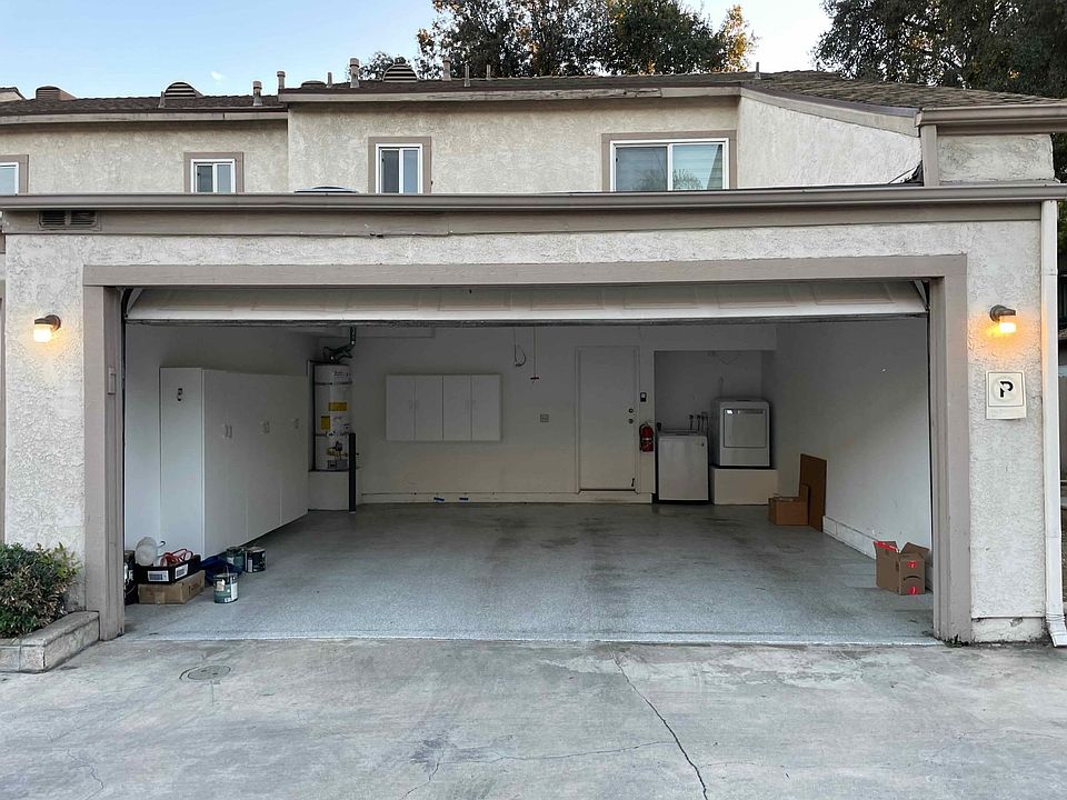 Spacious attached 2 car garage with epoxy flooring and storage. In-unit laundry washer and dryer.