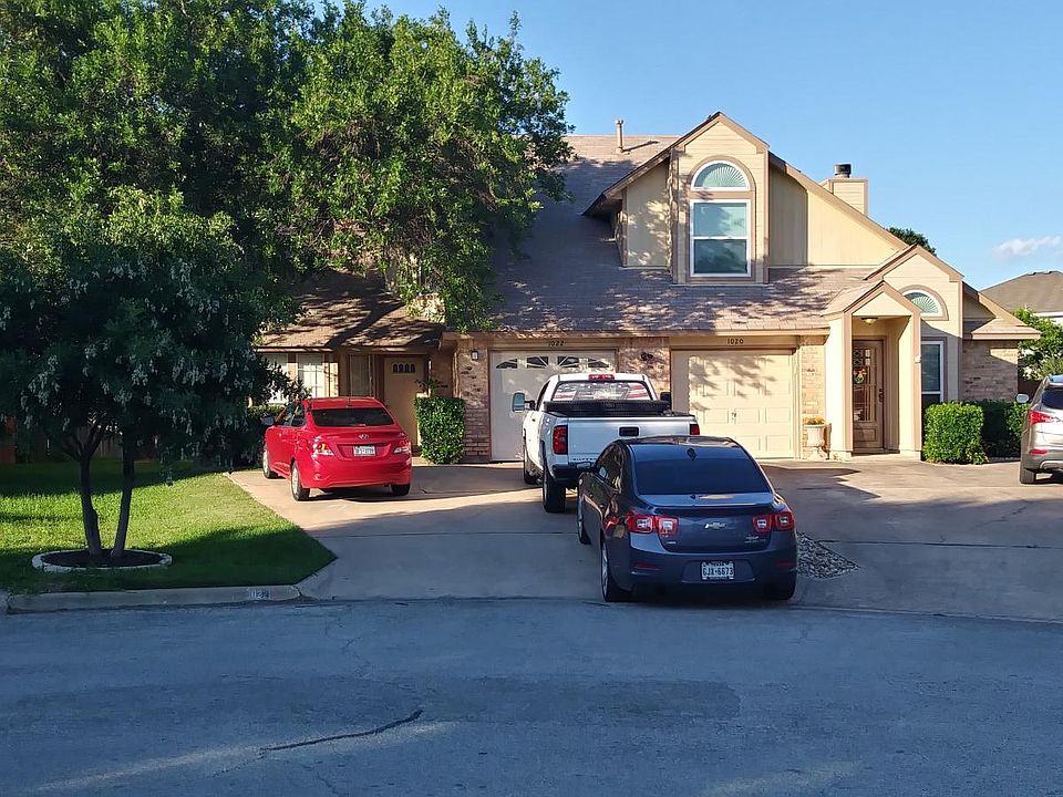 Front driveway view. Left side. Can park up to 4 vehicles in driveway.