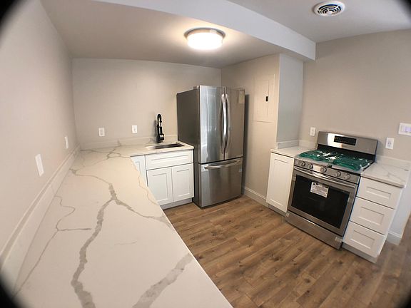 Modern, open kitchen with gorgeous countertops!