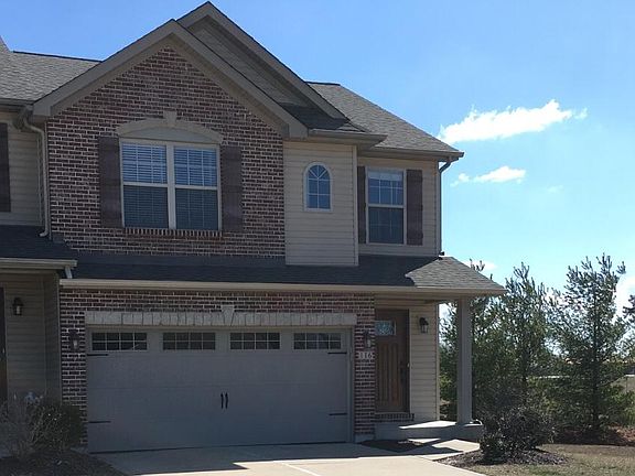 Brick front with carriage door