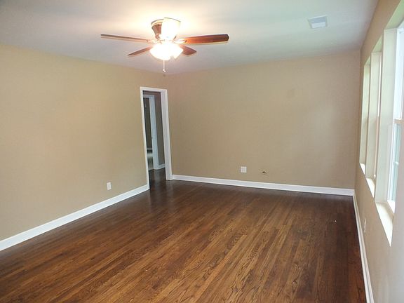 This spacious living room has hardwoods