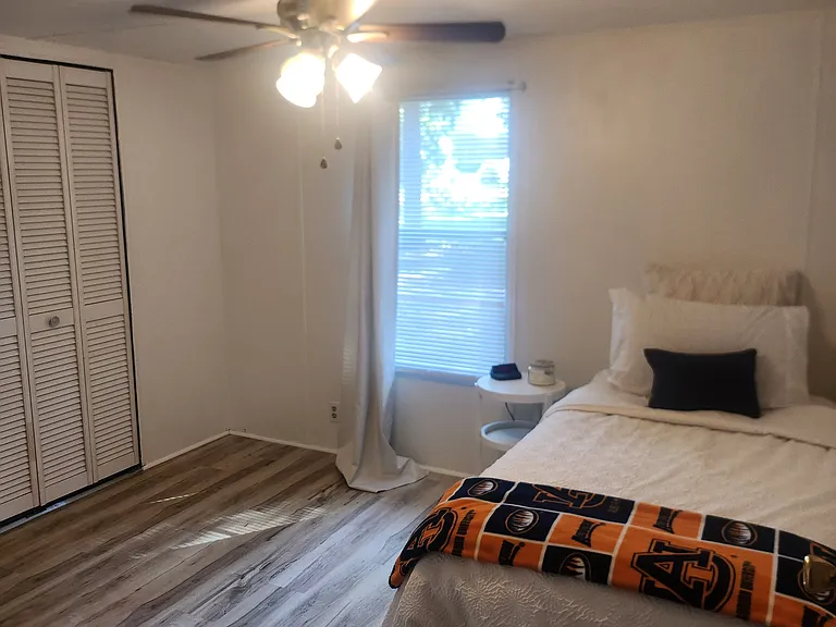 2nd bedroom with twin bed and large closet.