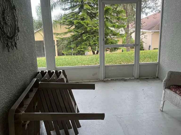 Lanai has 2 rocking chairs.