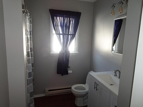 First floor bathroom / tub with shower