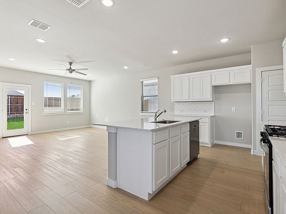 Kitchen in the Oak home plan by Trophy Signature Homes - REPRESENTATIVE PHOTO