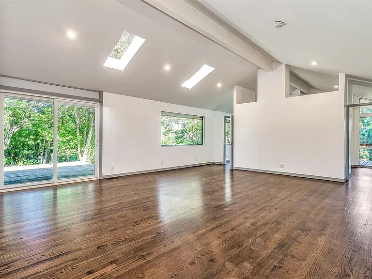 Vaulted ceilings with exposed beams and recessed lighting