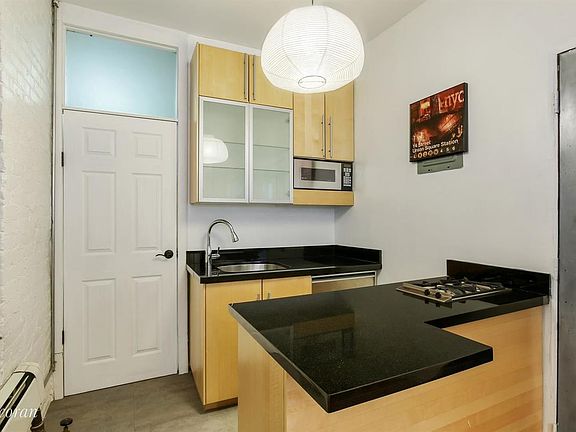 2nd image of 228 E 13th St APT 2