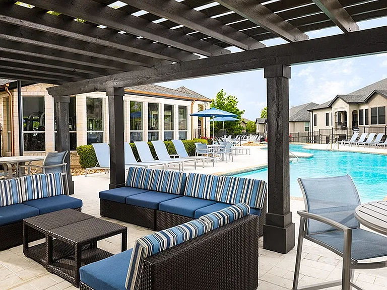 Spend an evening relaxing by the outdoor fireplace with lounge