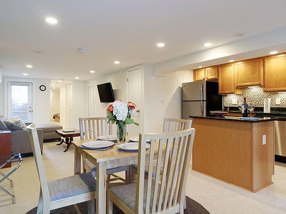 Open concept dining, kitchen, and living space.