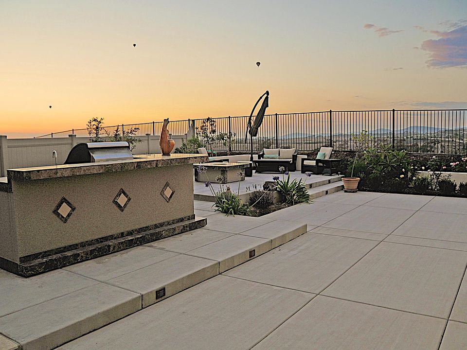 Backyard with panoramic view and custom-designed grill and fire pit