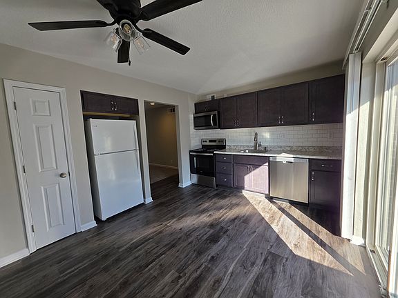 Newly renovated eat-in kitchen. New lighted celing fan, SS stove, miro-hood, and dishwasher, new cabinets.