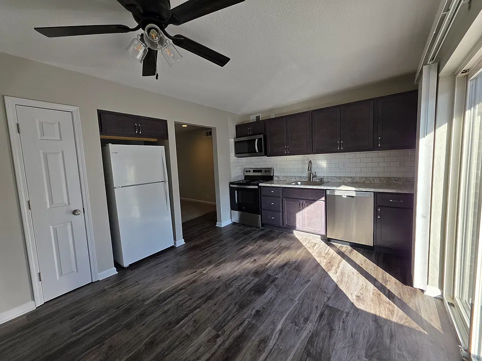 Newly renovated eat-in kitchen. New lighted celing fan, SS stove, miro-hood, and dishwasher, new cabinets.