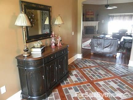 Custom Designed Floor
						:
						Portsone pavers and wood flooring