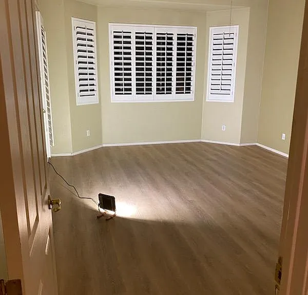 Master bedroom retreat. Brand new L.V.P. flooring, plantation shutters. Picture taken at night on November 13, 2023 standing at bedroom door.