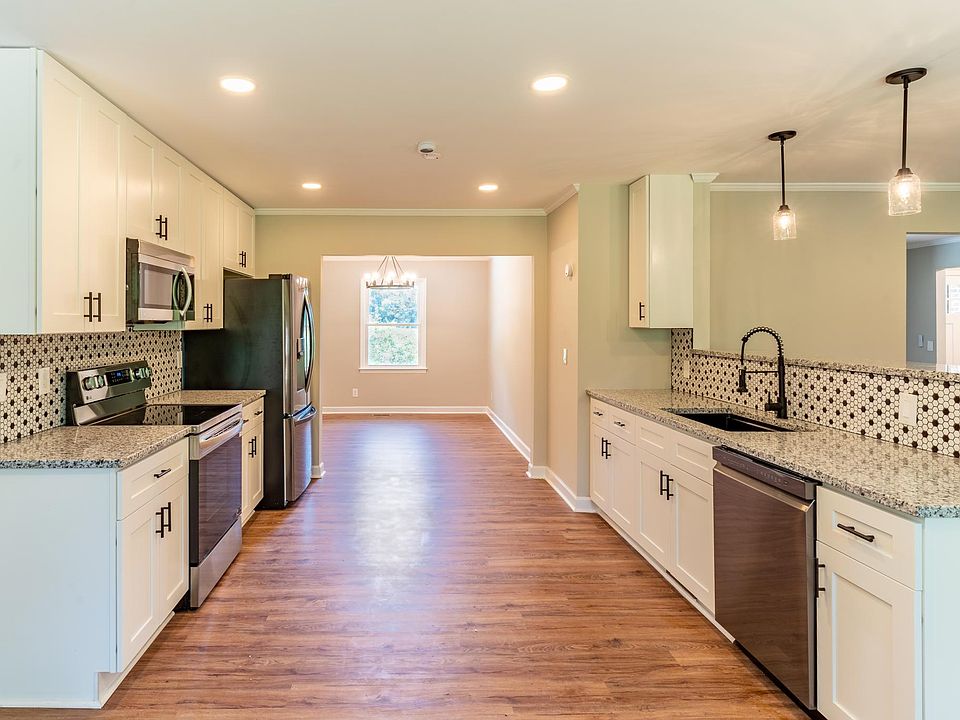 Kitchen with SS appliances and ample storage.