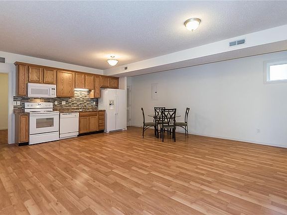 Upon entertaining you are greeted with a flowing common great space that has the flexibility of Kitchen Preparation, Dining, and a large great room lounge area claim the space.  Many of the residents have installed portable islands in the space and it is 