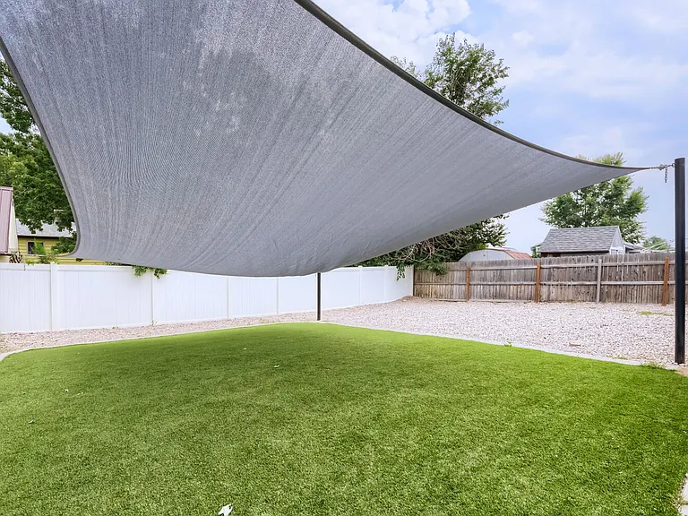 Covered yard and zero scape! YARD AND WATER INCLUDED IN THE RENT
