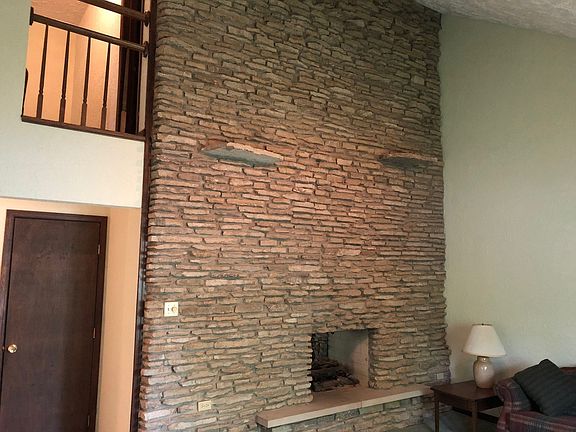 Full cathedral Wall 2-sided fireplace ...living room thru to family room.