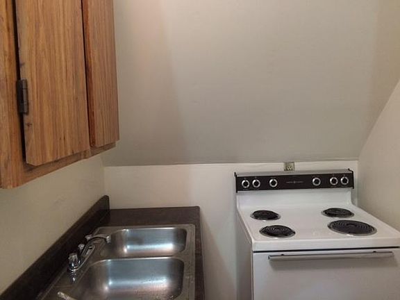 Kitchen with sink and stove.