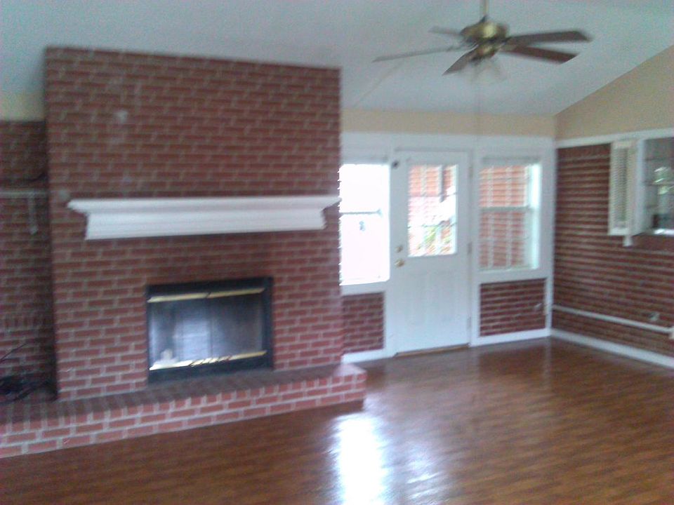 Large den with fireplace