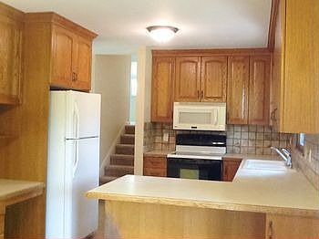 Another view of the kitchen showing the breakfast bar.