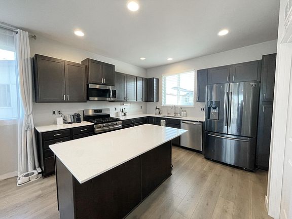 Kitchen w/ Stainless appliances.