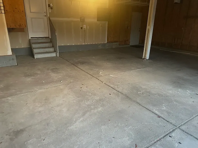 Large 3 car garage with storage overhead