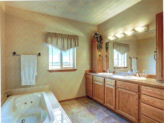 master bathroom with whirlpool tub, separate shower, separat