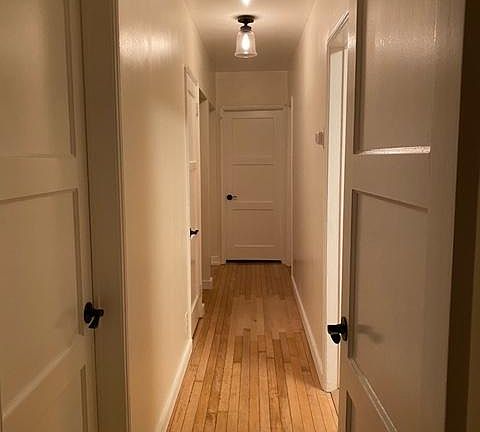 Hallway to bedrooms and bathroom. In hall there is a closet, along with storage area