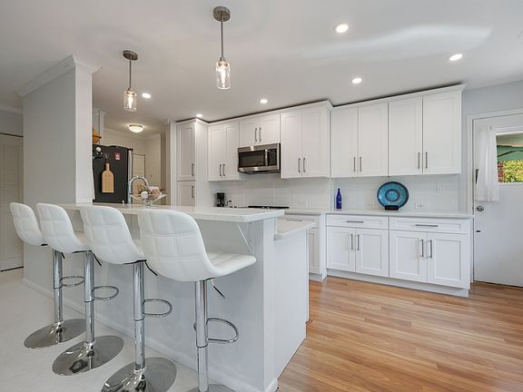 Nice counter space and hanging Edison Lights all with dimmers