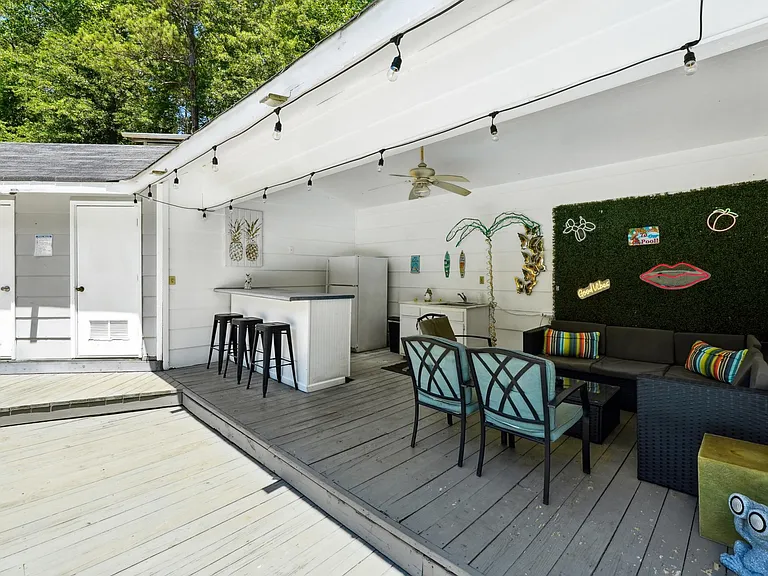 Pool house lounge with outdoor kitchen (sink only usable in summer pool season)