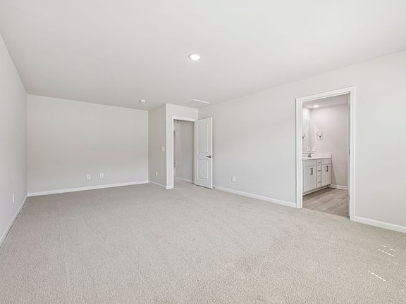 Primary bedroom in the Chatham floorplan at a Meritage Homes community in Garner, NC.