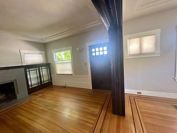 Built in cabinets on both sides of (non-working) fireplace