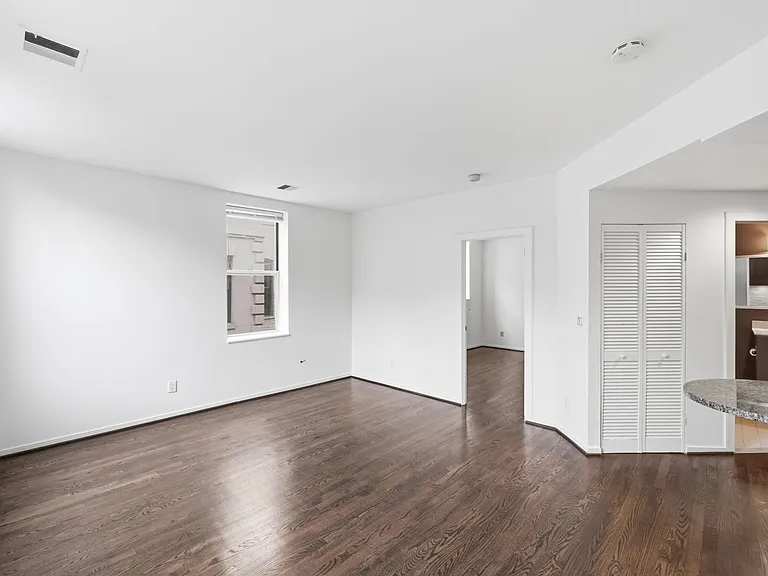 Sun-Filled Living Room with Dark Wood Flooring
