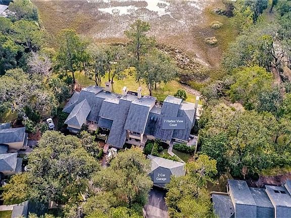 Drone view of the courtyard, decks and marsh
