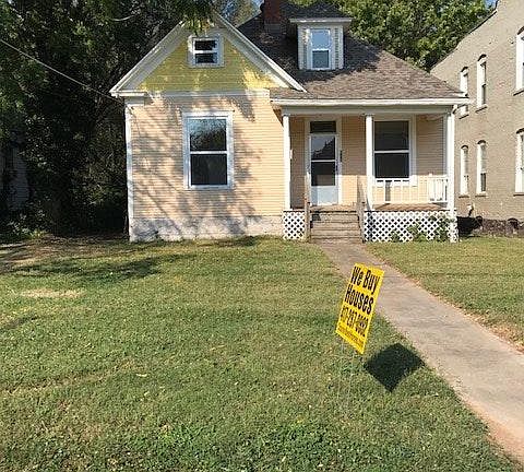 Front of home with new windows and roof and covered porch