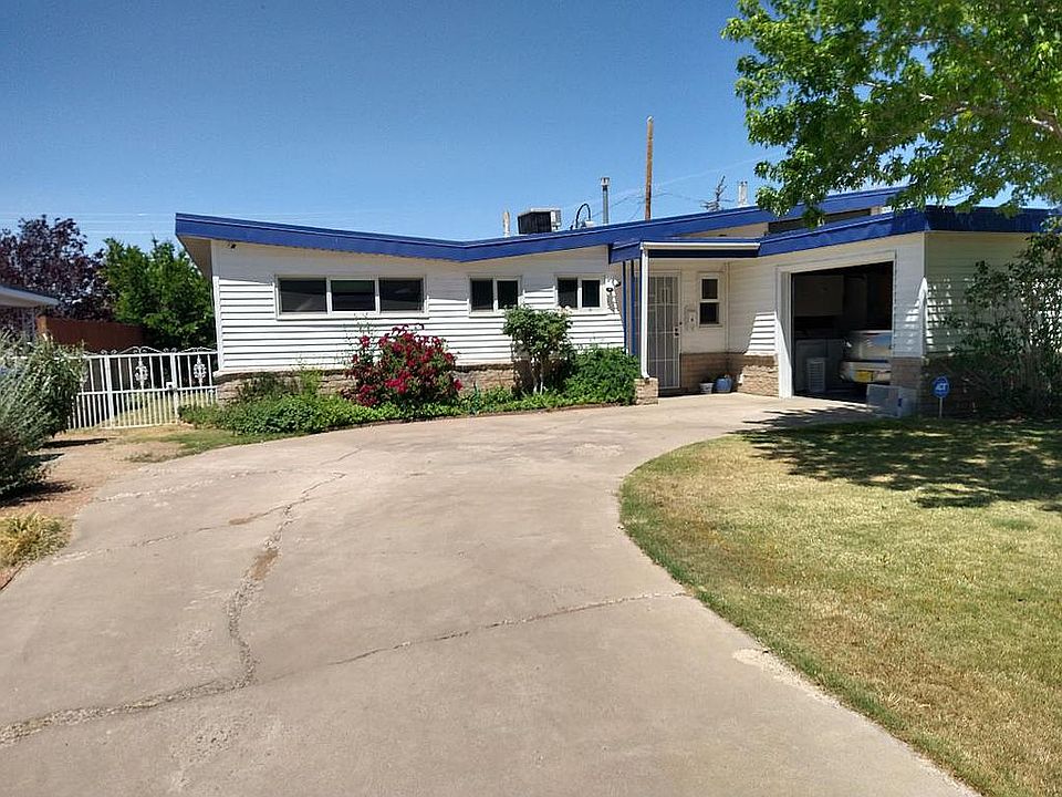 Front of house, garage open