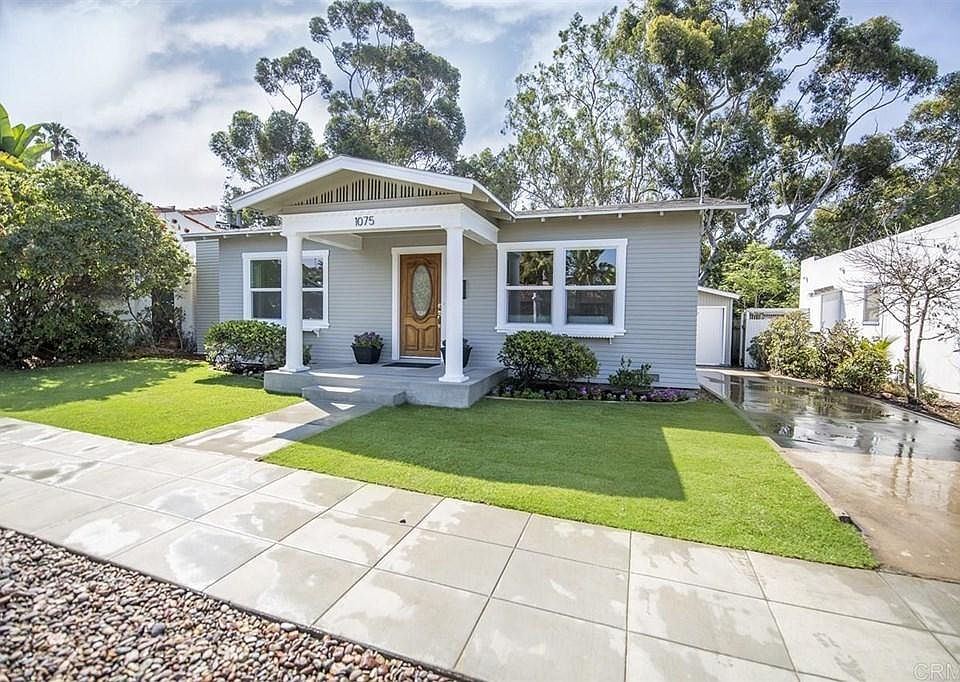 Front of house with porch and yard.