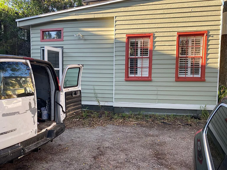 Apartment is behind the main house. Here is its entrance and parking