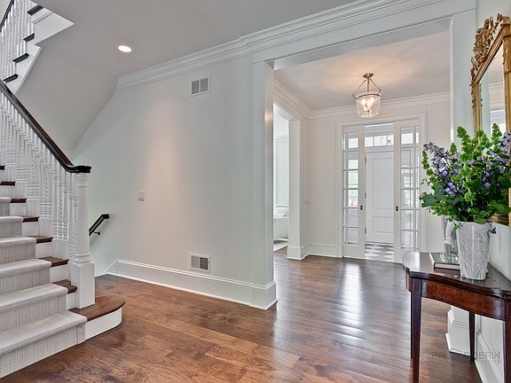 Vestibule opens to spacious foyer with main staircase