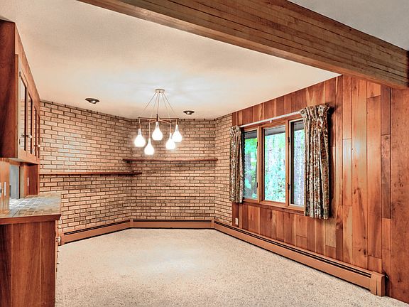 The dining room is directly off the living room and features a pass-through to the kitchen.